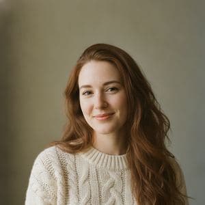 Portrait of a woman in a cream knit jumper