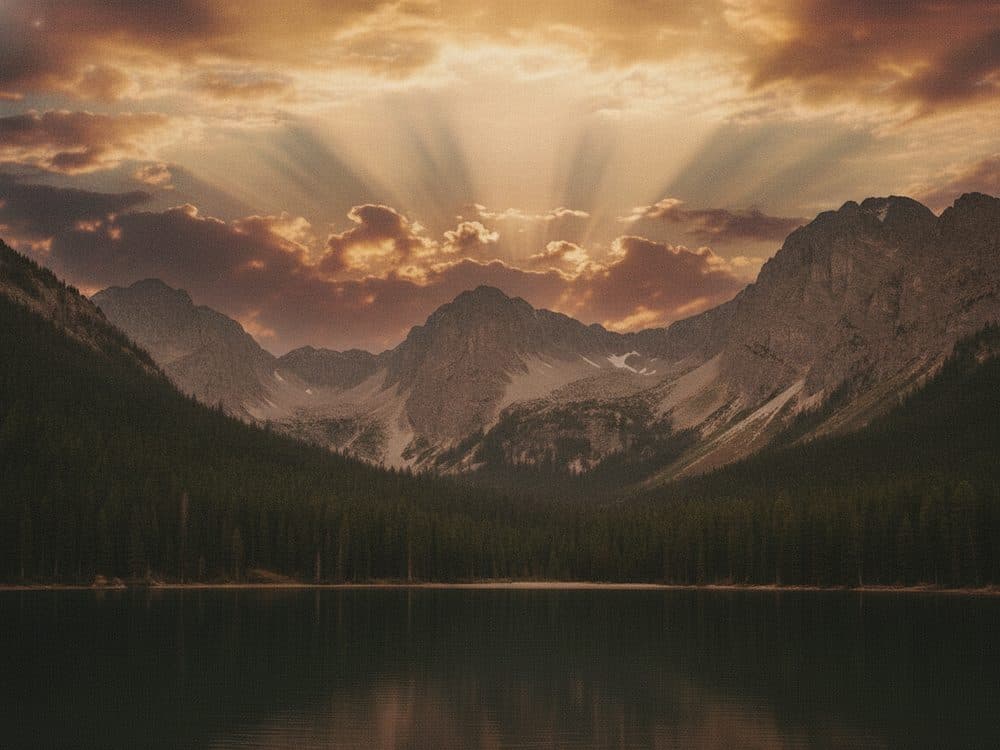 A mountain lake under a dramatic sunset sky, replacing the original flat grey one
